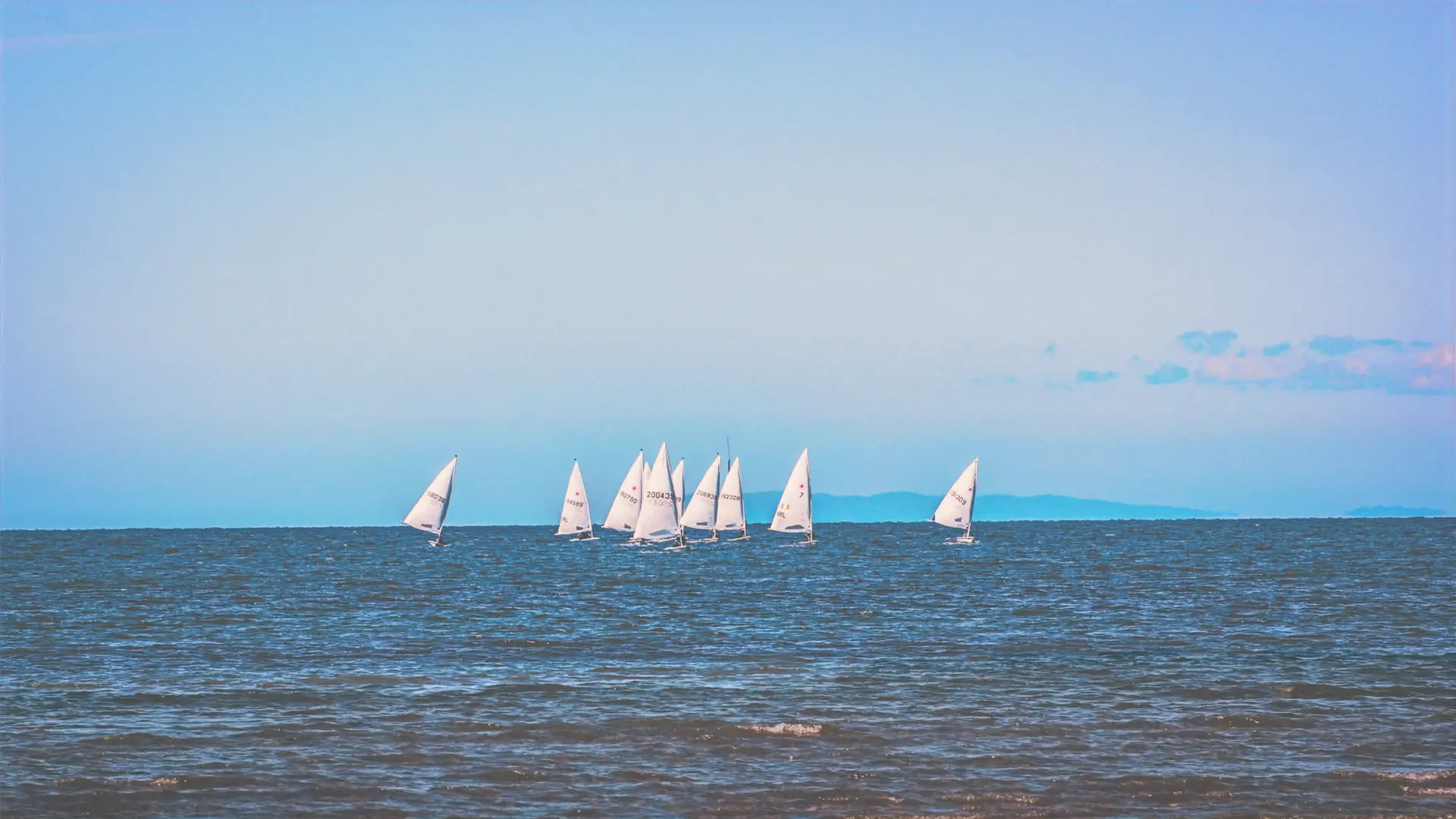 Sailboats on the ocean during daytime